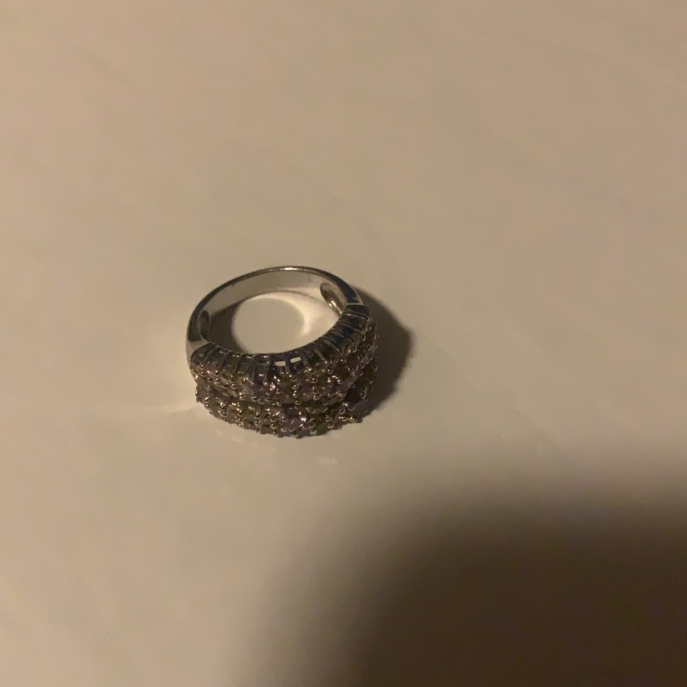 Really beautiful silver tone pink diamond ring no marks that I can see